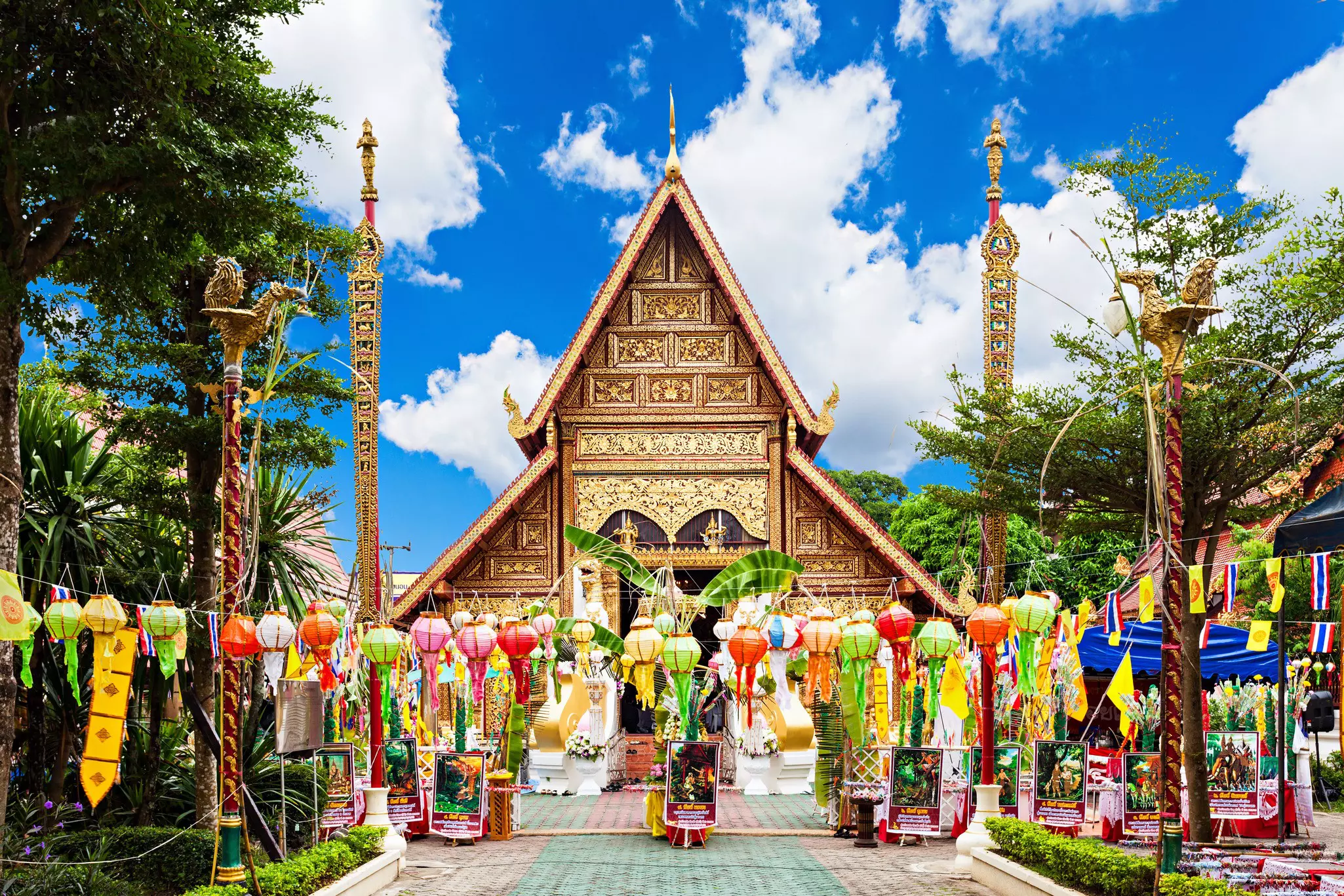 Colorful paper lanterns and bunting outside Phra Singh buddhist temple in Chiang Mai, Thailand