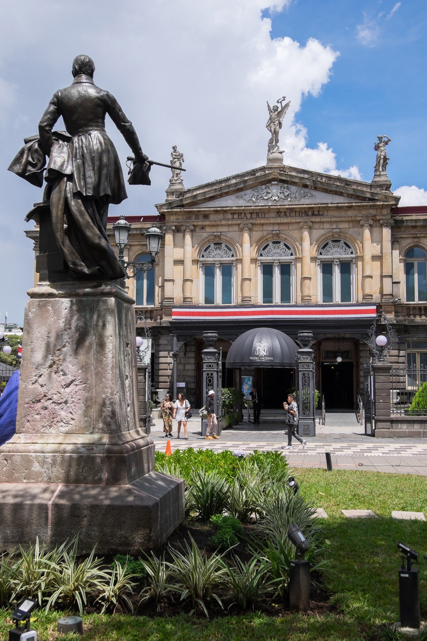 San José, Costa Rica - October 08, 2022: Juan Mora Square and National Theater in the urban center of the city