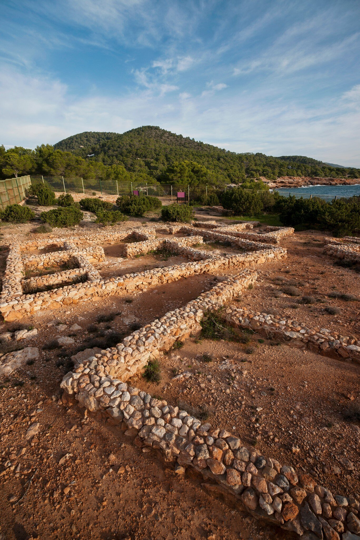 View of the ruins of the first human settlement in Ibiza, Poblament Fenici de Sa Caleta, in Spain.
