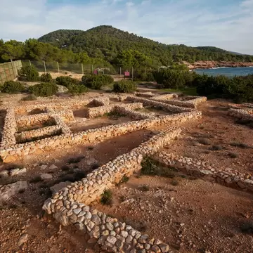View of the ruins of the first human settlement in Ibiza, Poblament Fenici de Sa Caleta, in Spain.