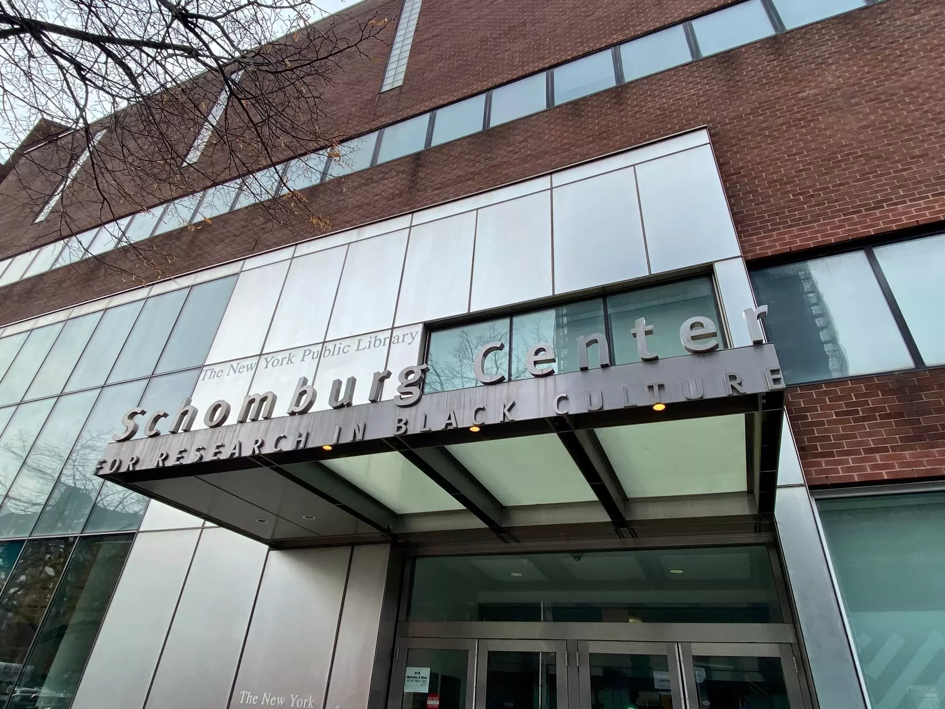 New York, NY USA - December 5, 2023 : Schomburg Center for Research in Black Culture sign over the entrance of the building on Malcolm X Boulevard in Harlem, New York City, License Type: media, Download Time: 2024-09-01T16:59:08.000Z, User: pinkjozie64, Editorial: true, purchase_order: 56530, job: Global Publishing WIP, client: Experience New York 2, other: Jo-anne Riddell
