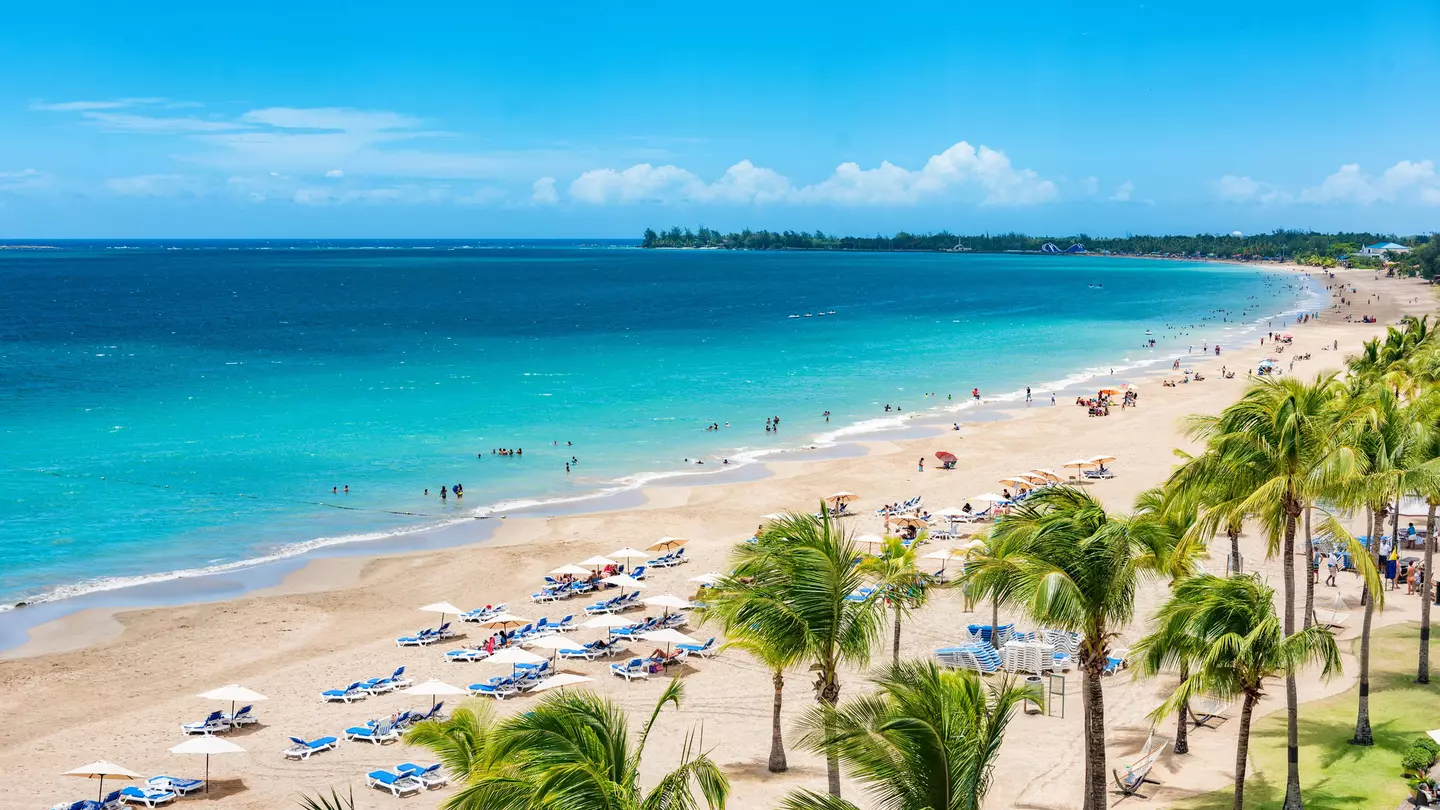 Puerto Rico beach travel vacation landscape background. Isla Verde resort in San Juan, famous tourist cruise ship destination in the Caribbean.