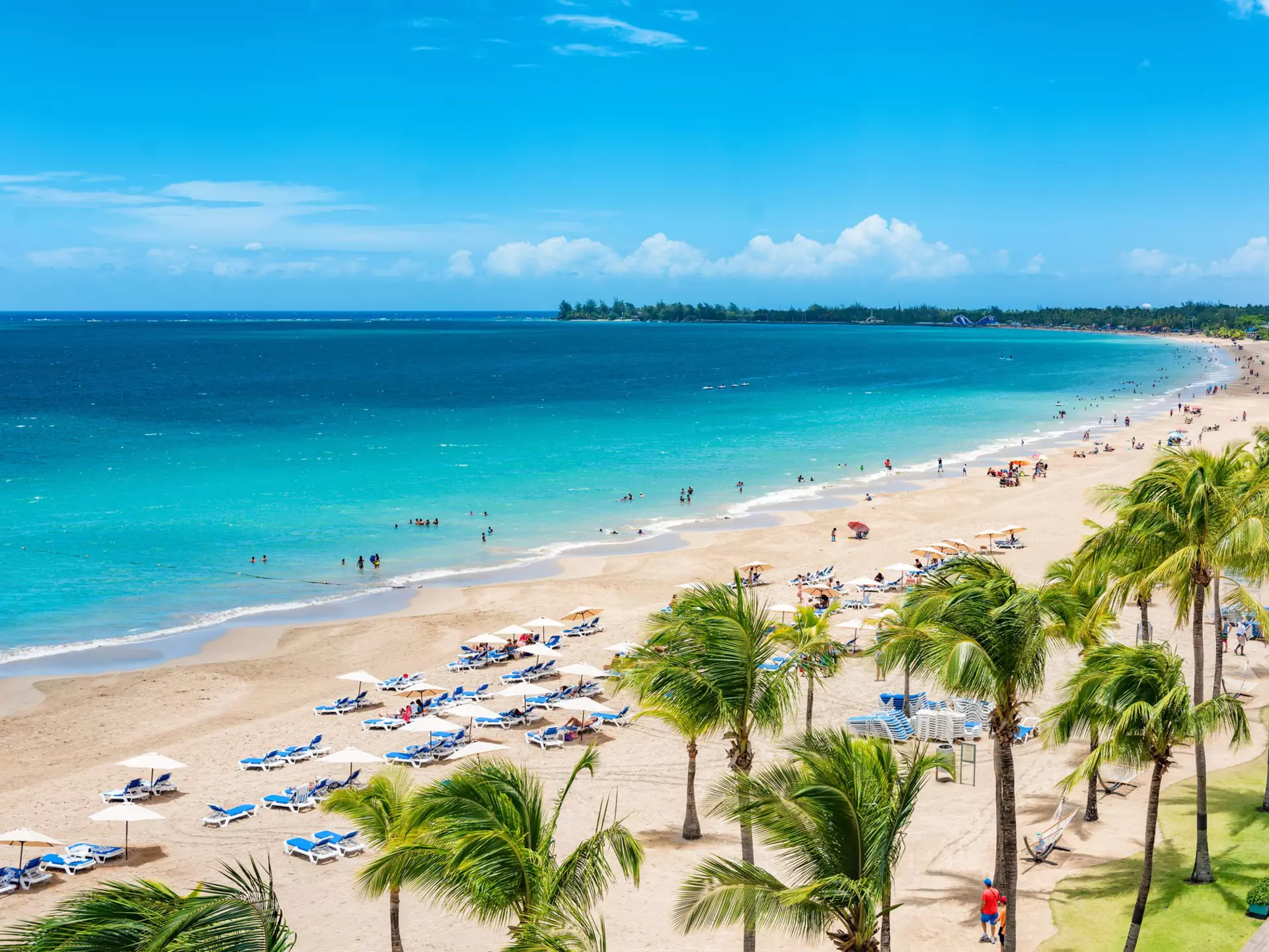 Puerto Rico beach travel vacation landscape background. Isla Verde resort in San Juan, famous tourist cruise ship destination in the Caribbean.