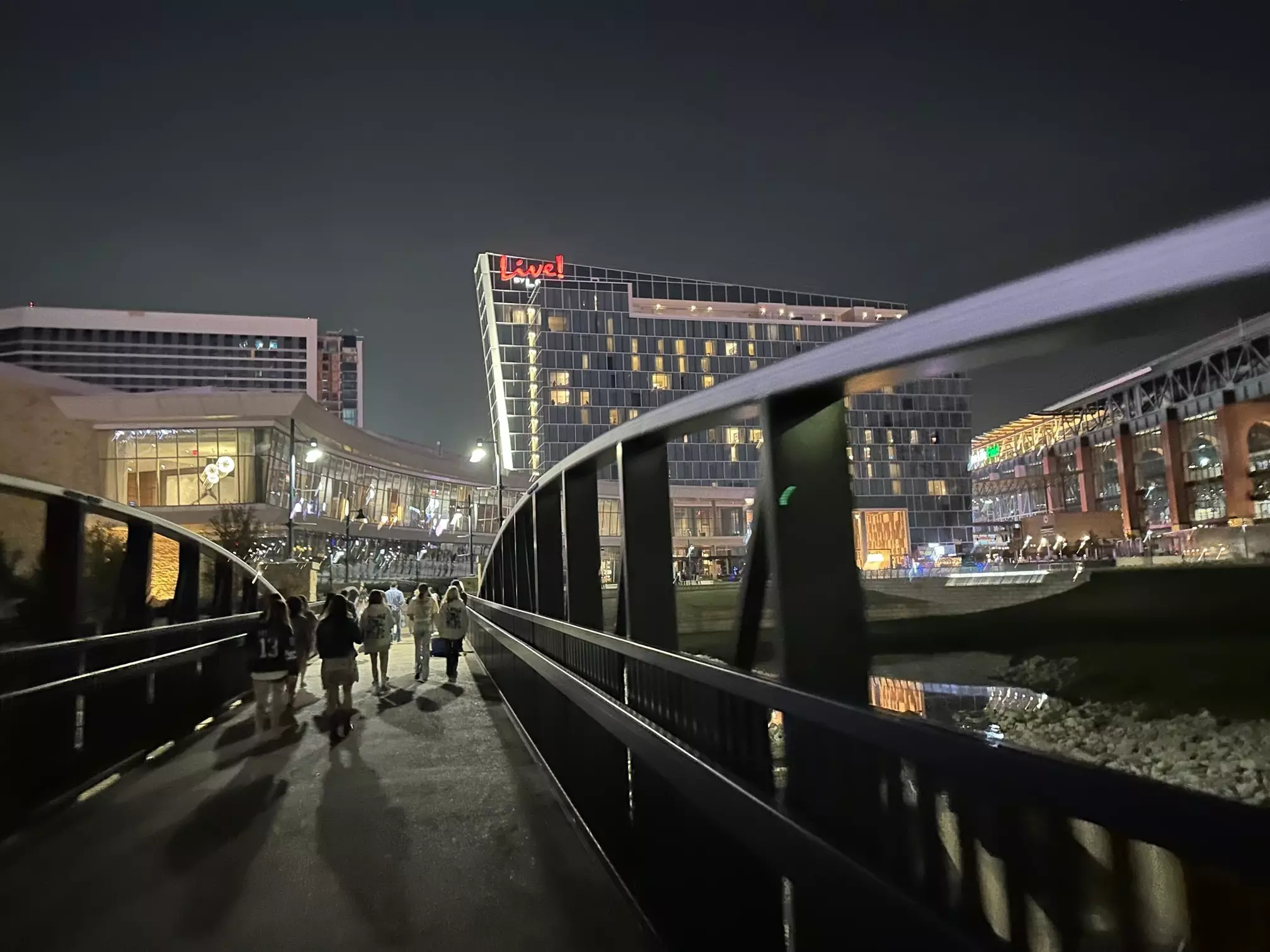 Fans walk to nearby Live by Loews Hotel after the Taylor Swift concert at nearby AT&T Stadium in Arlington, Texas. ©Melissa Yeager/Lonely Planet