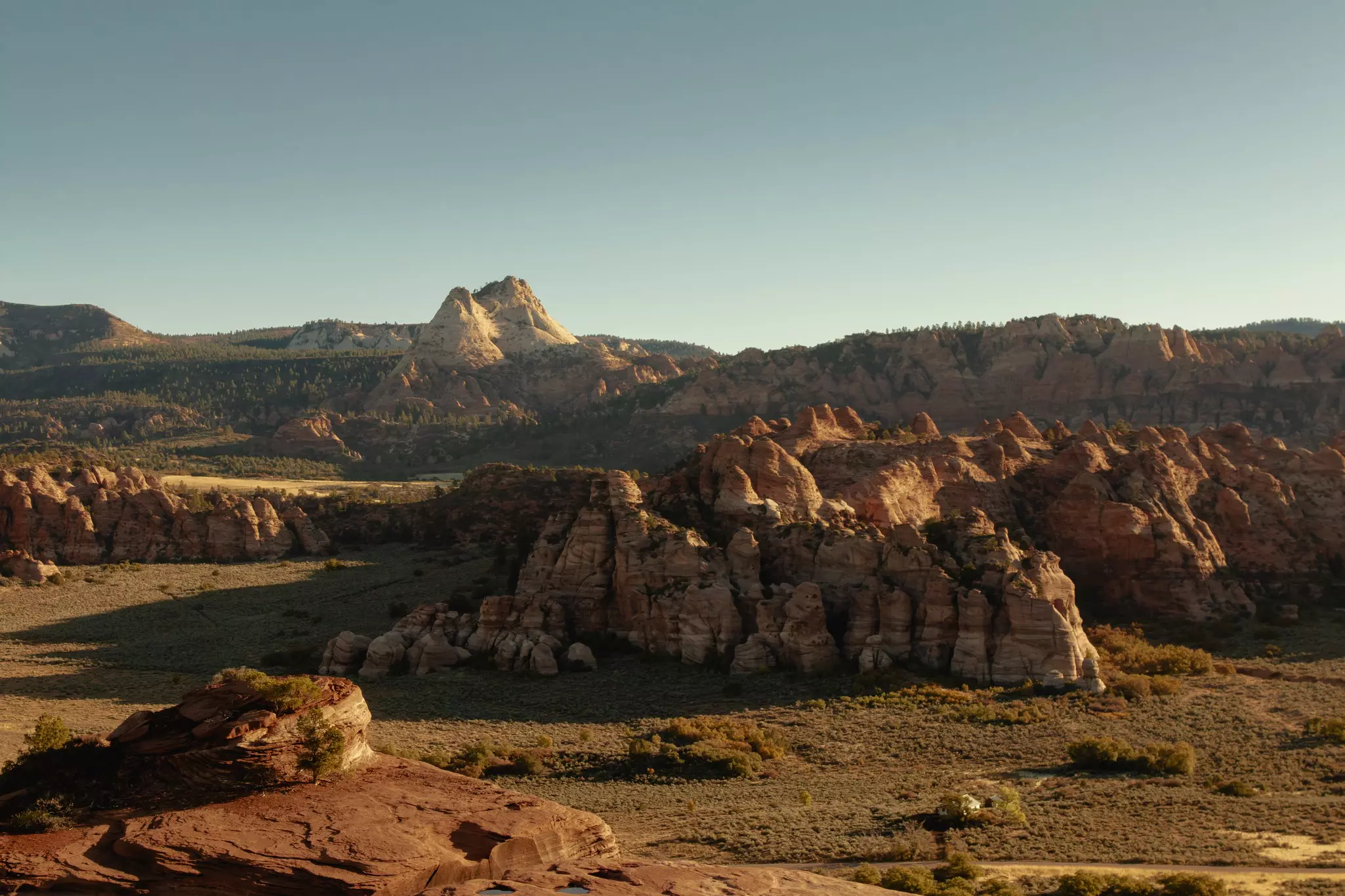 Rocky formations lit by morning sun.