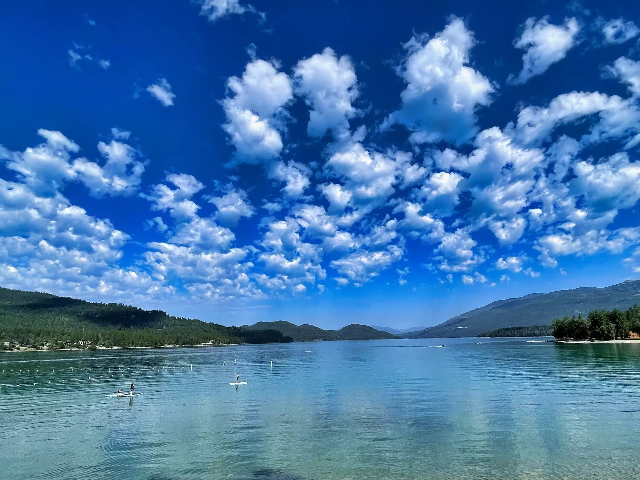 Stand-up Paddleboarders in Glacier National Park, Montana © Matt Paco / Lonely Planet