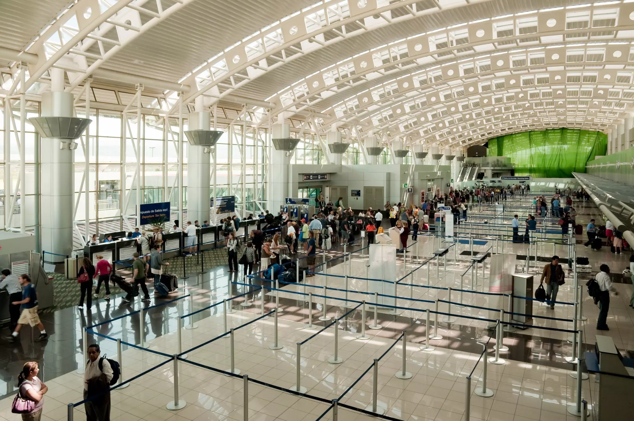 The busy airport check-in area at Juan Santamarîa International in San José, Costa Rica 