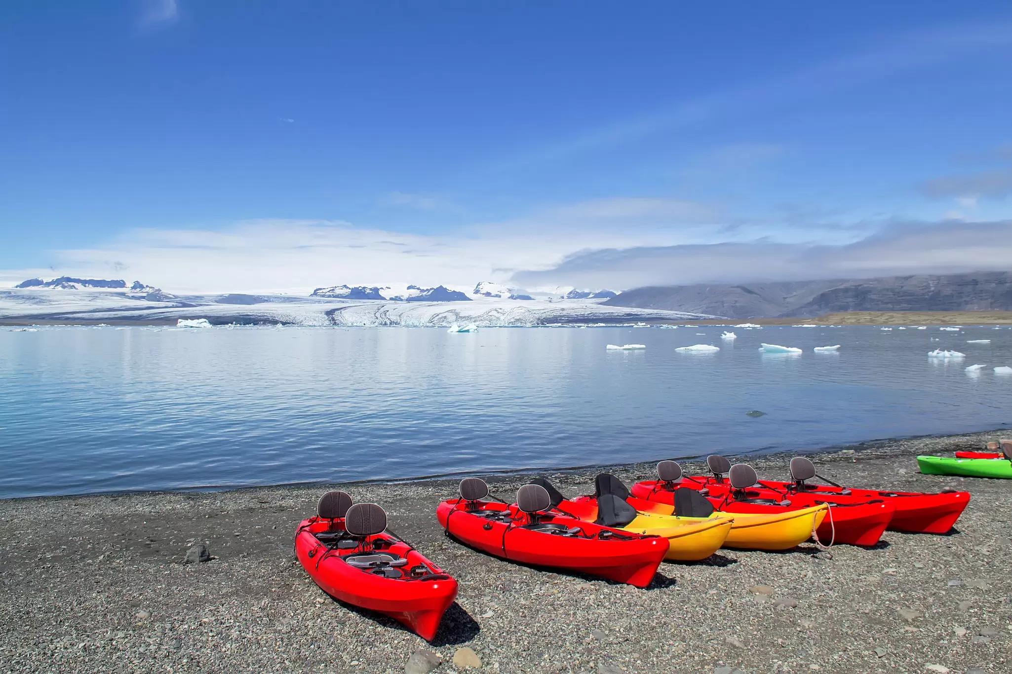 Kayaks on the shore of the Jökulsárlón glacier lagoon in Iceland.