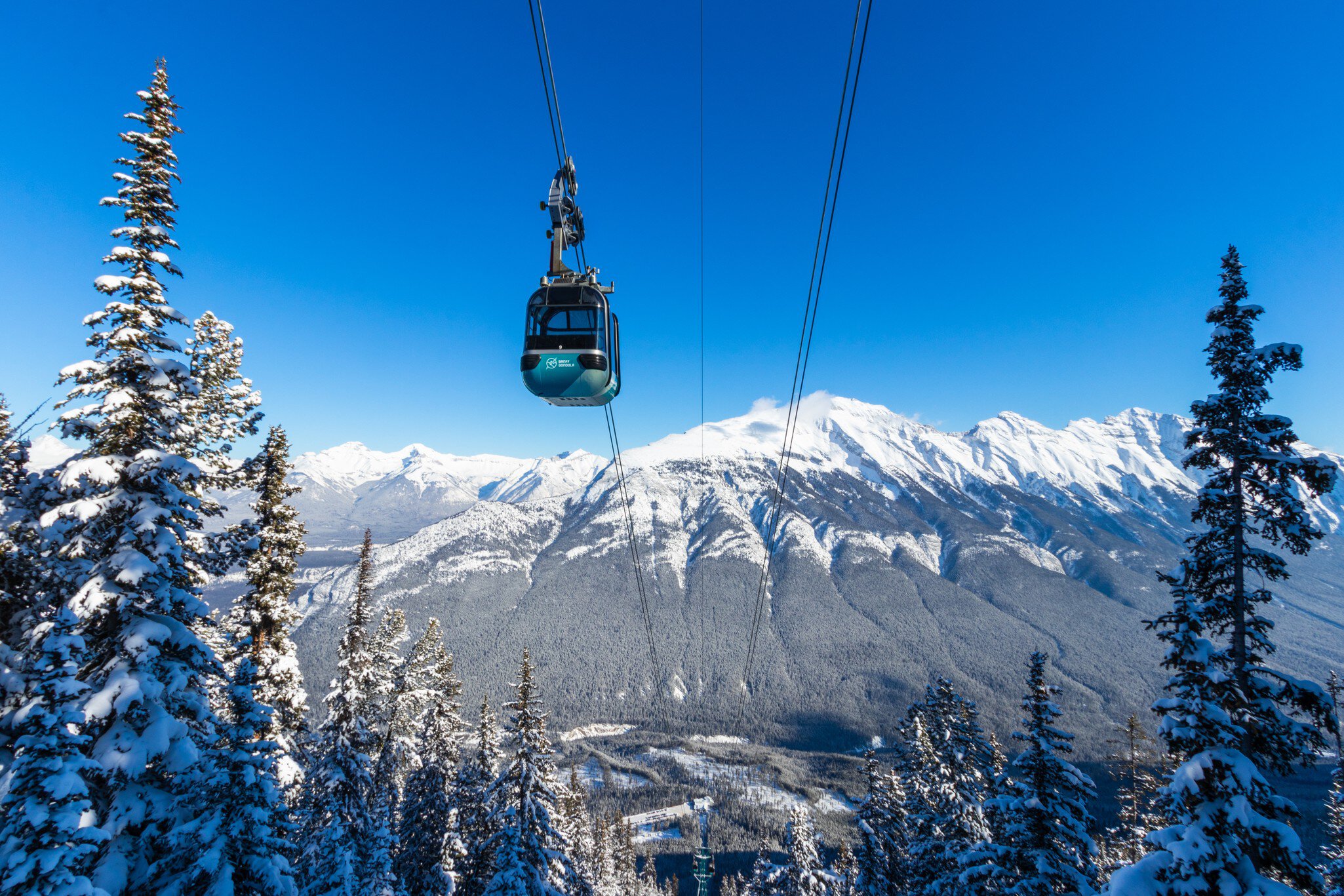 Banff, Alberta / Canada - 2.6.2019: Gondola winter views at Sulphur Mountain, Travel Alberta, Tourism, Banff National Park, Canada  License Type: media  Download Time: 2023-10-18T02:44:22.000Z  User: dermothegarty77  Is Editorial: Yes  purchase_order:   
