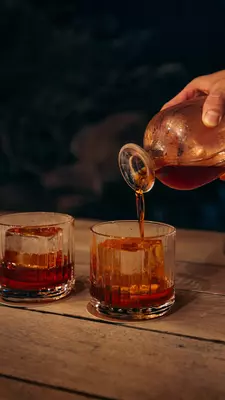 Amber-colored drinks on a table at Noe