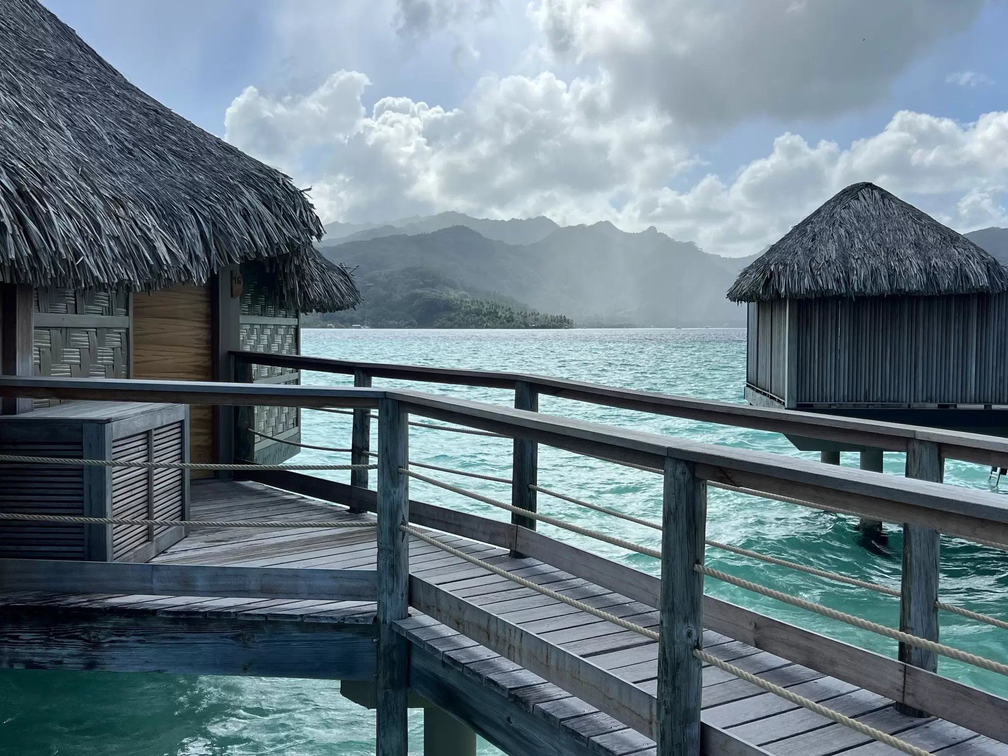 A dock pathway connects overwater bungalows at luxury tropical resort, Taha‘a, French Polynesia
