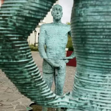 View of David Černý’s "urinating" sculpture titled "Proudy" in Prague, Czechia.