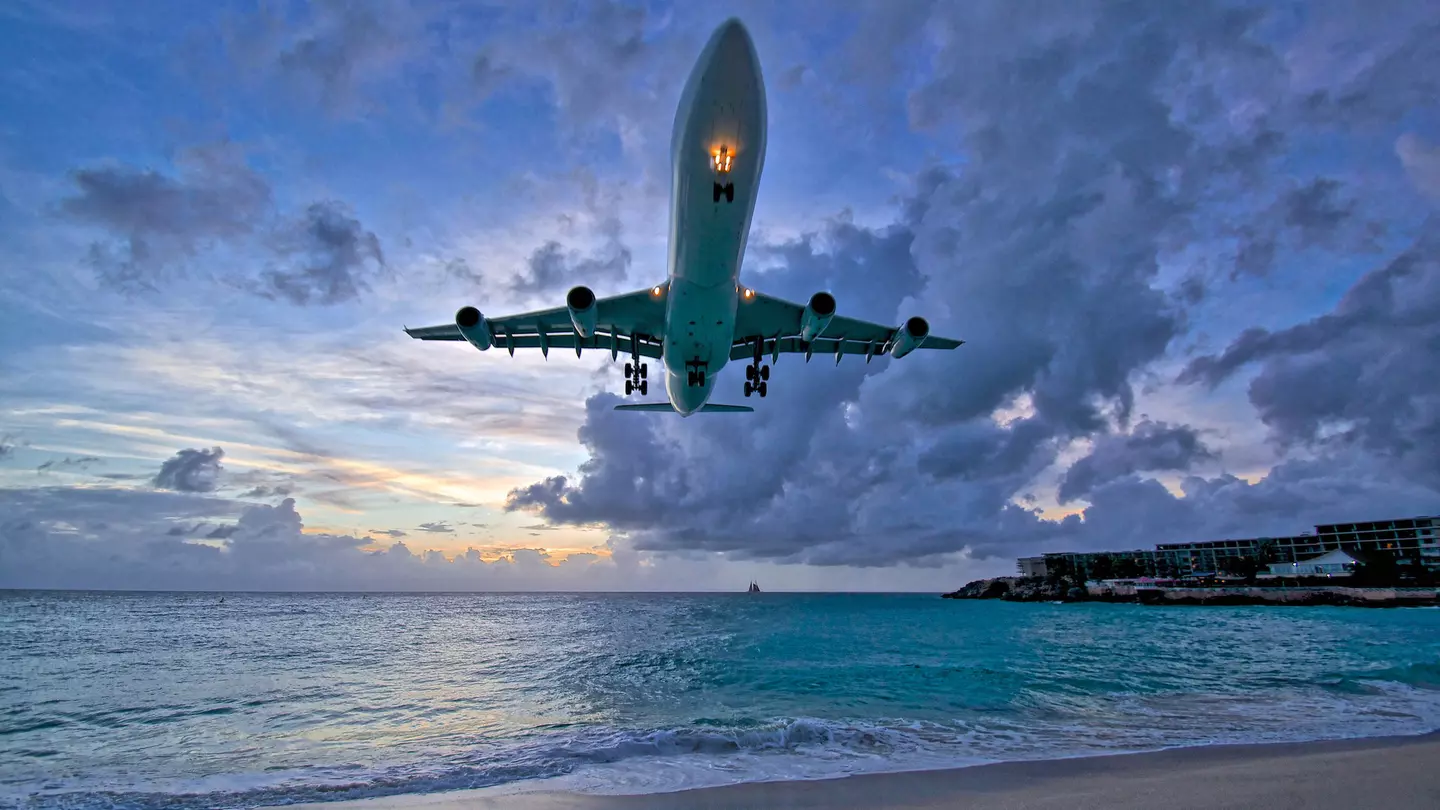 Air France plane landing at Princess Juliana International Airport (PJIA) at sunset on St.Maarten.
