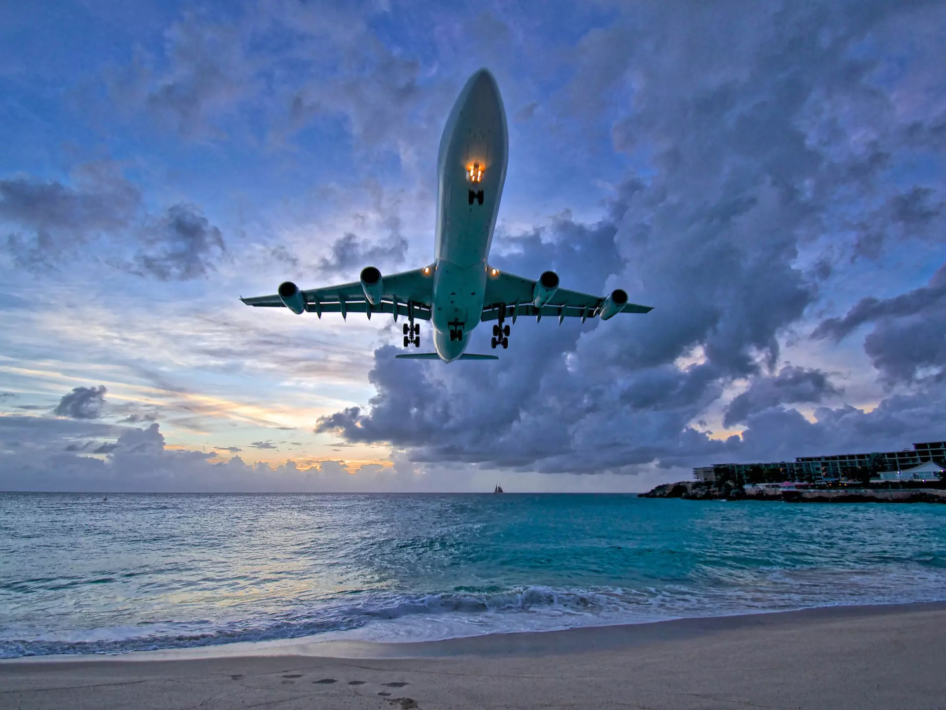 Air France plane landing at Princess Juliana International Airport (PJIA) at sunset on St.Maarten.