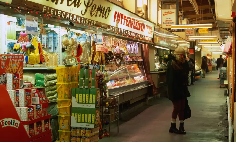 Shoppers and stalls inside Marheineke Markthalle, Marheinekeplatz.