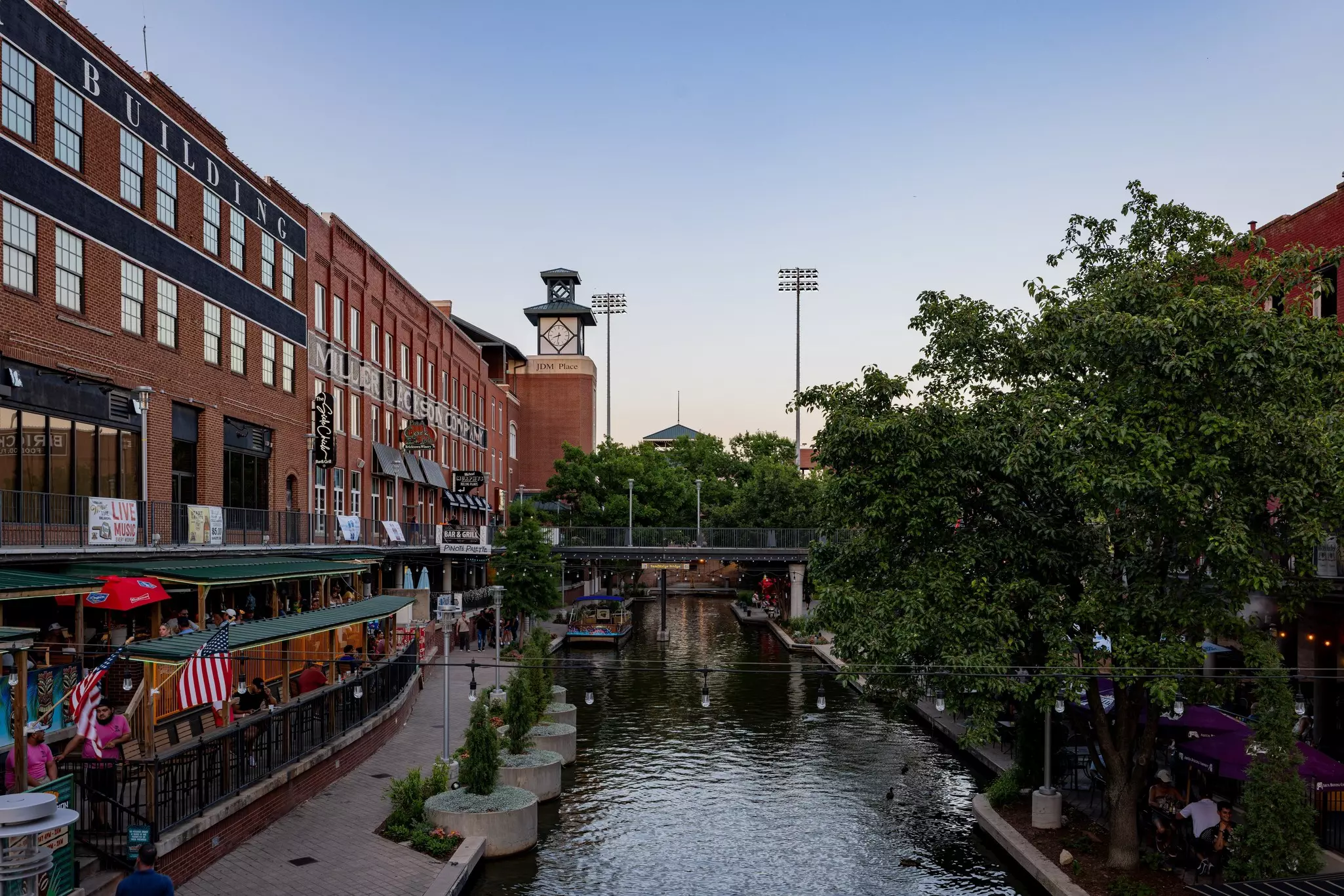 View of brick buildings along a river 
