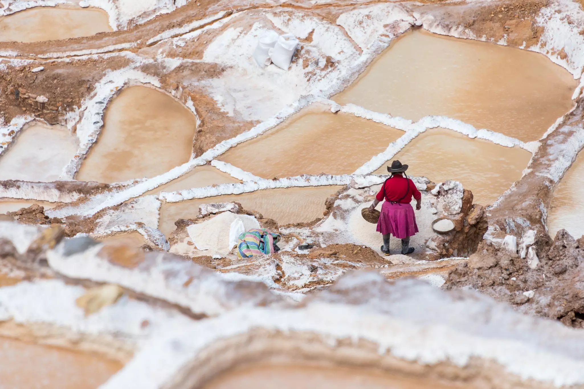 Local families continue to mine the ancient salt pans of Maras, which are carved into a mountainside © Marquicio Pagola / Shutterstock