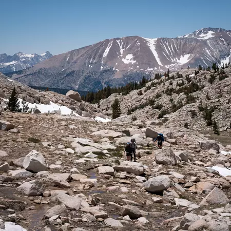 Huge bolders along a hiking trail in a mountain pass.