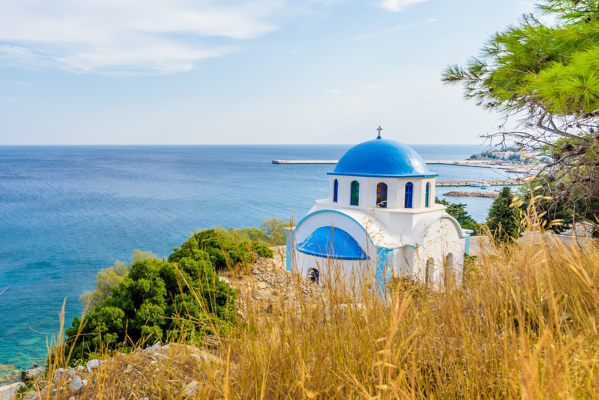 Blue and white Greek church of Agios Kirykos, situated on the rocky coast of Ikaria Island.
755976409
abstract, aegean, agios, angle, architecture, background, beach, beautiful, beauty, bell tower, blue, calm, church, city, clear, cross, crystal, culture, daylight, destination, dome, europe, greece, greek, holiday, ikaria, island, landscape, mediterranean, orthodox, orthodox church, outdoor, religion, roof, sea, shore, sky, summer, summertime, tourism, town, travel, turquoise, vacation, vacations, view, village, water, white, wide