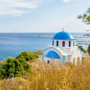 Blue and white Greek church of Agios Kirykos, situated on the rocky coast of Ikaria Island.
755976409
abstract, aegean, agios, angle, architecture, background, beach, beautiful, beauty, bell tower, blue, calm, church, city, clear, cross, crystal, culture, daylight, destination, dome, europe, greece, greek, holiday, ikaria, island, landscape, mediterranean, orthodox, orthodox church, outdoor, religion, roof, sea, shore, sky, summer, summertime, tourism, town, travel, turquoise, vacation, vacations, view, village, water, white, wide