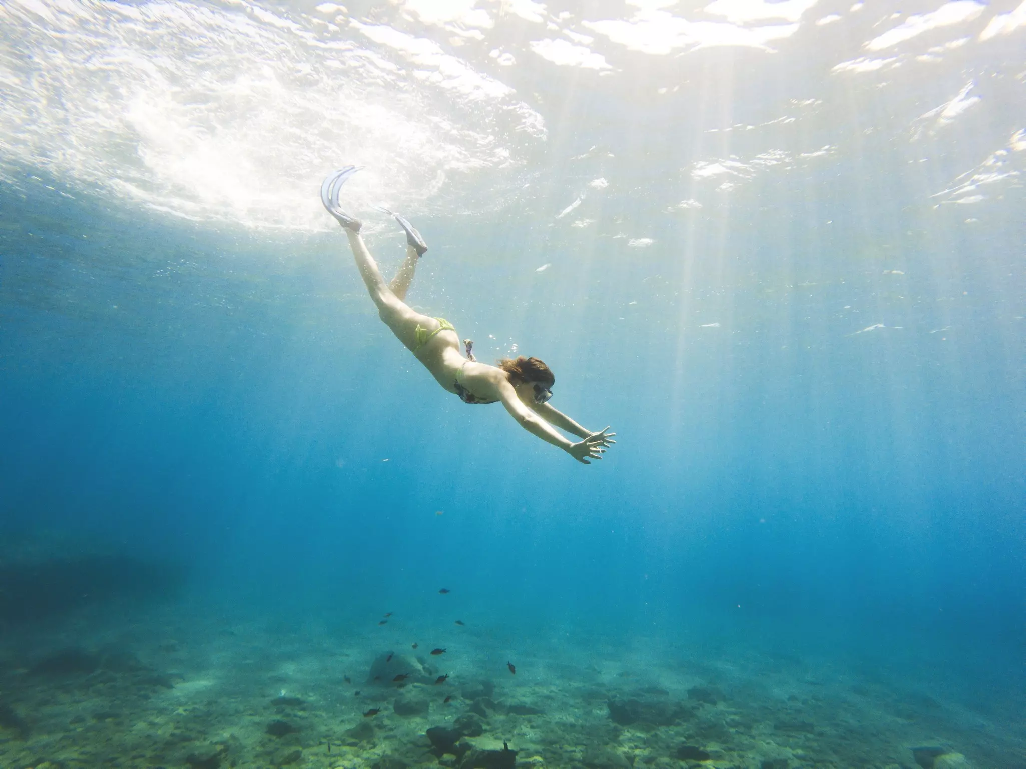 Woman diving in Greece