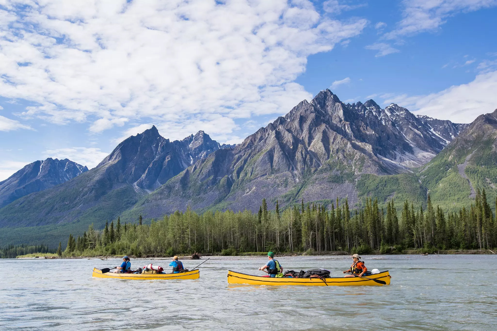 Group paddling down the whitewater of the Nahanni River in the Northwest Territories