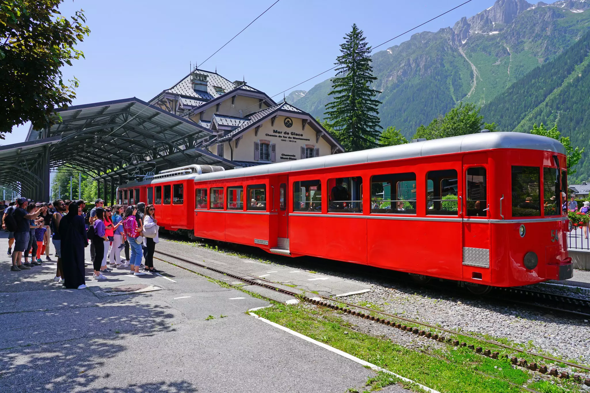 The bright red Train du Montenvers at a station in the French Alps. 