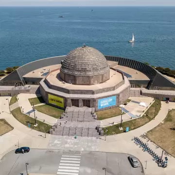 Aerial view of Adler Planetarium with Lake Michigan in the background in Chicago, Illinois.