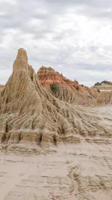 a hoodoo like rock formation in a desert 
