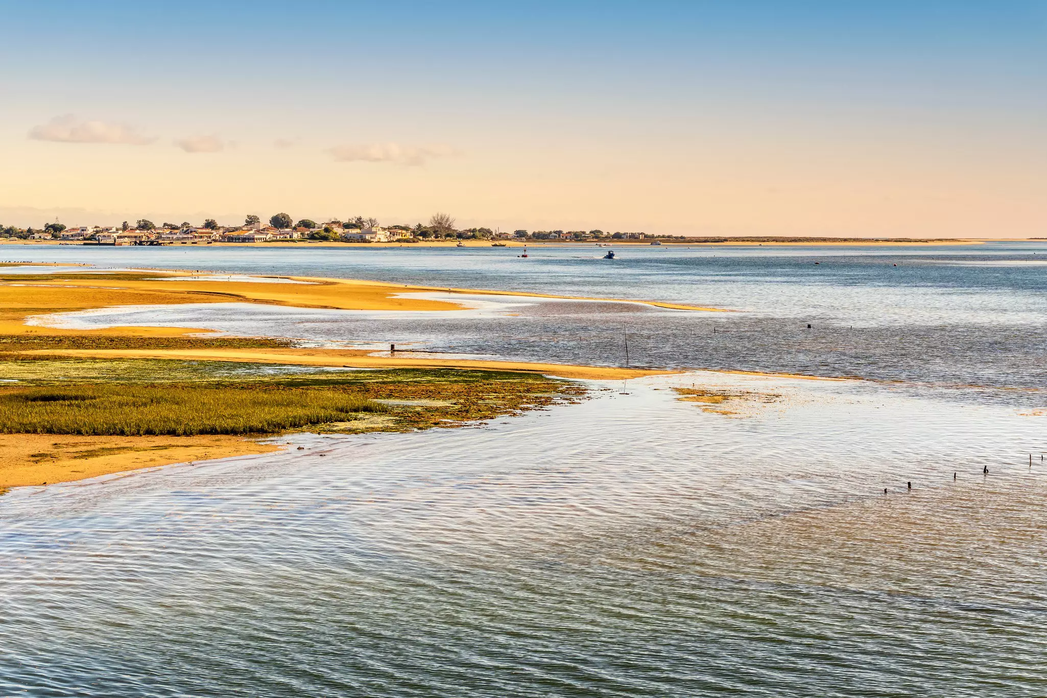 Exposed sand of a wetland near an island