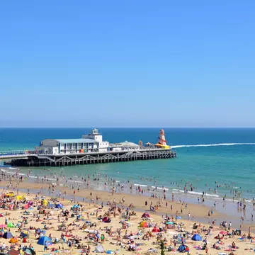 Detail of Bournemouth Pier and crowded beach.