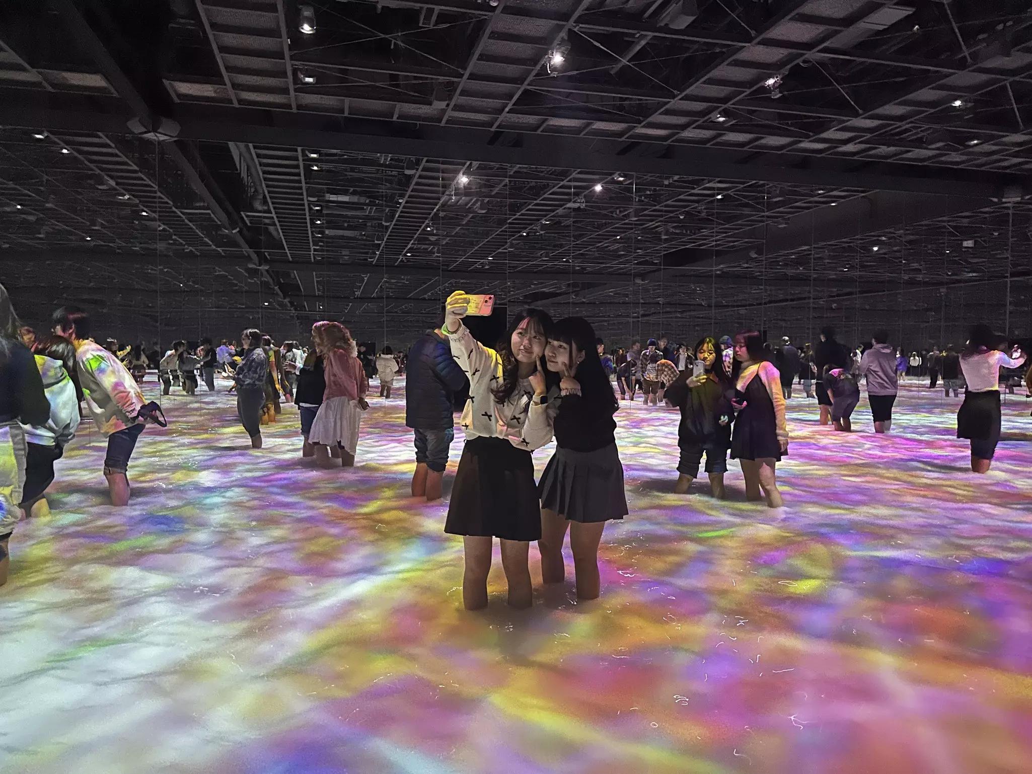 wading in the water at teamLab Planets