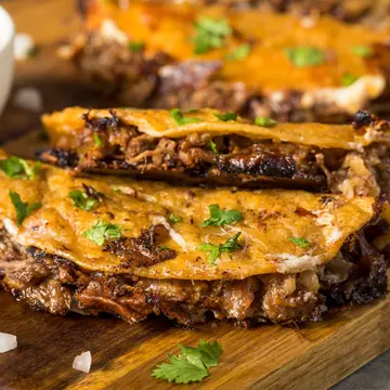 Homemade birria tacos. Brent Hofacker/Shutterstock