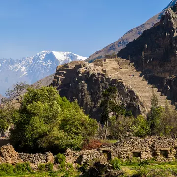 View of Ollantaytambo Ruins in the Sacred Valley, Peru with snowtopped mountains beyond