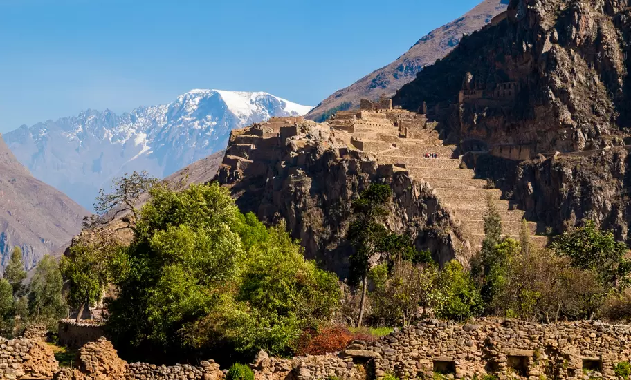 View of Ollantaytambo Ruins in the Sacred Valley, Peru with snowtopped mountains beyond
