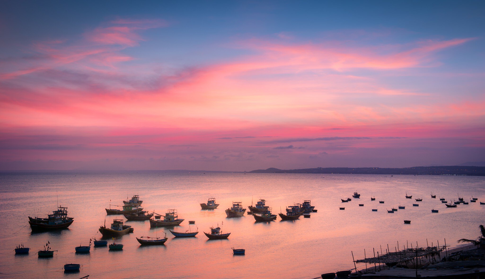 Elevated view of boats in bay at sunset, Mui Ne, Phan Thiet, Vietnam
