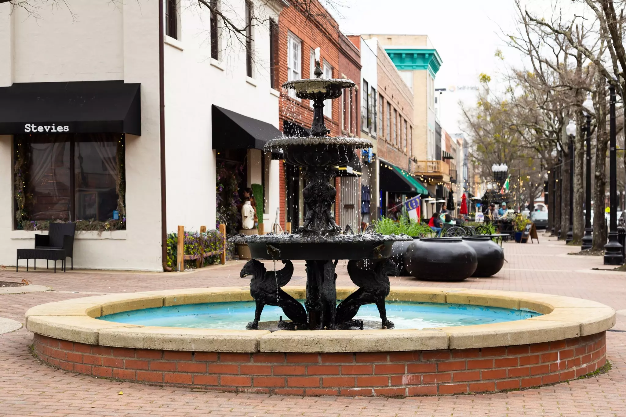 Selective focus view of pretty public vintage fountain on Hay Street in Fayetteville
