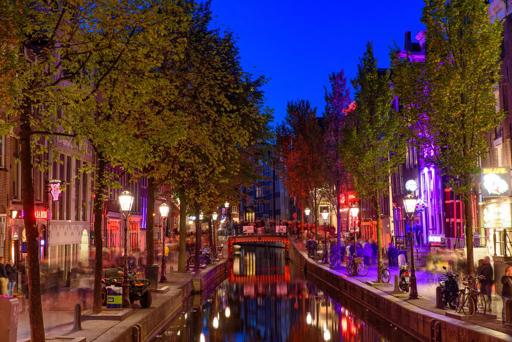 Night view of De Wallen, the famous red-light district with window prostitution in Amsterdam, Netherlands