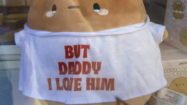 Man using a torch on a baked potato