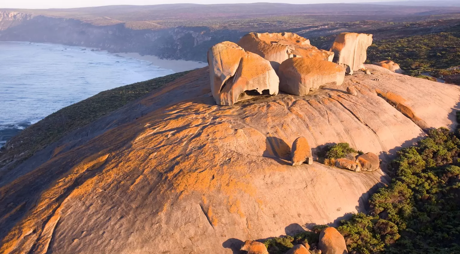 Large red rock formations overlooking the ocean