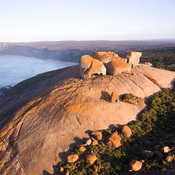 Large red rock formations overlooking the ocean