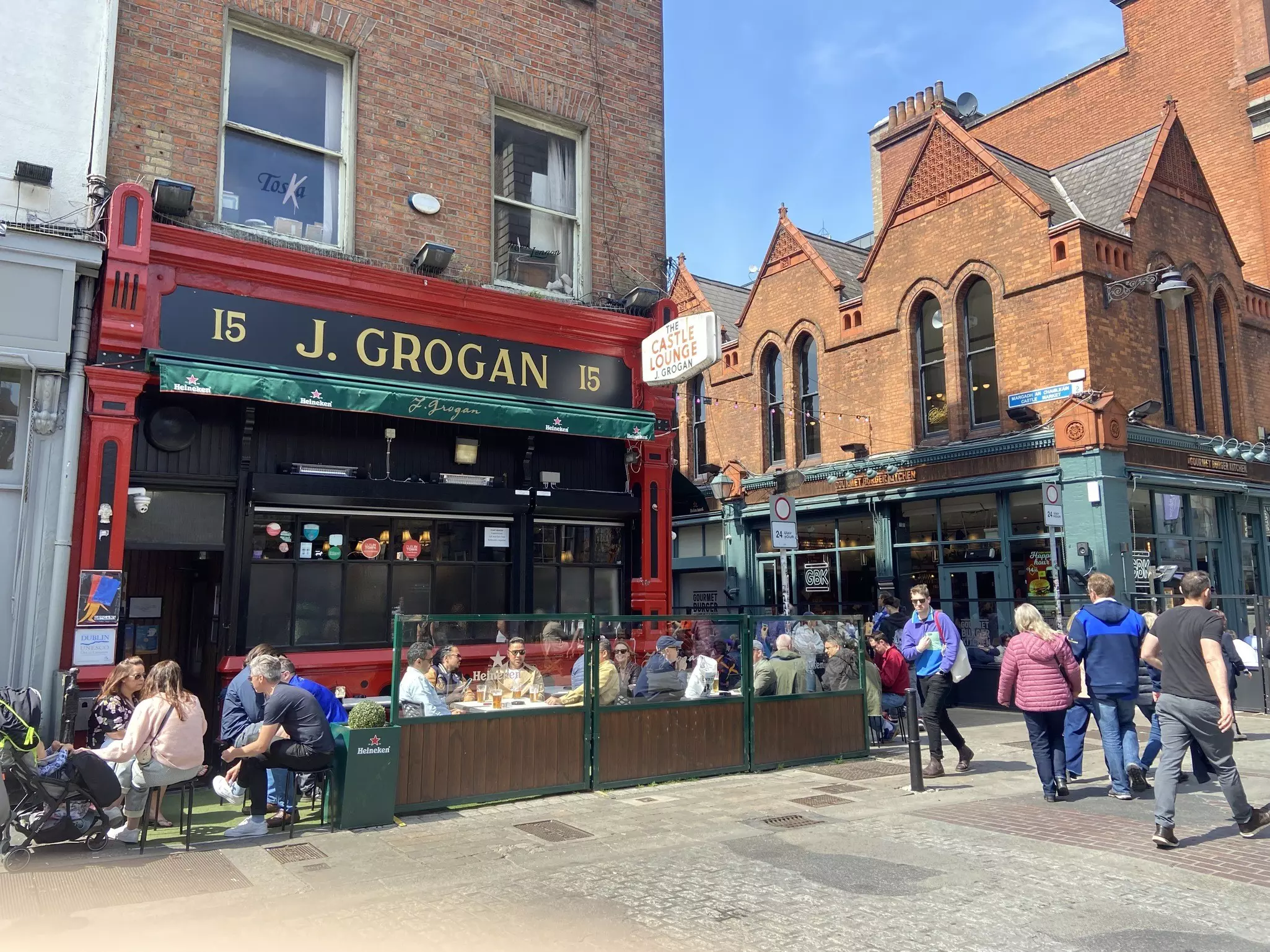 Patrons enjoying the sunshine outside Grogans Pub in Dublin, Ireland