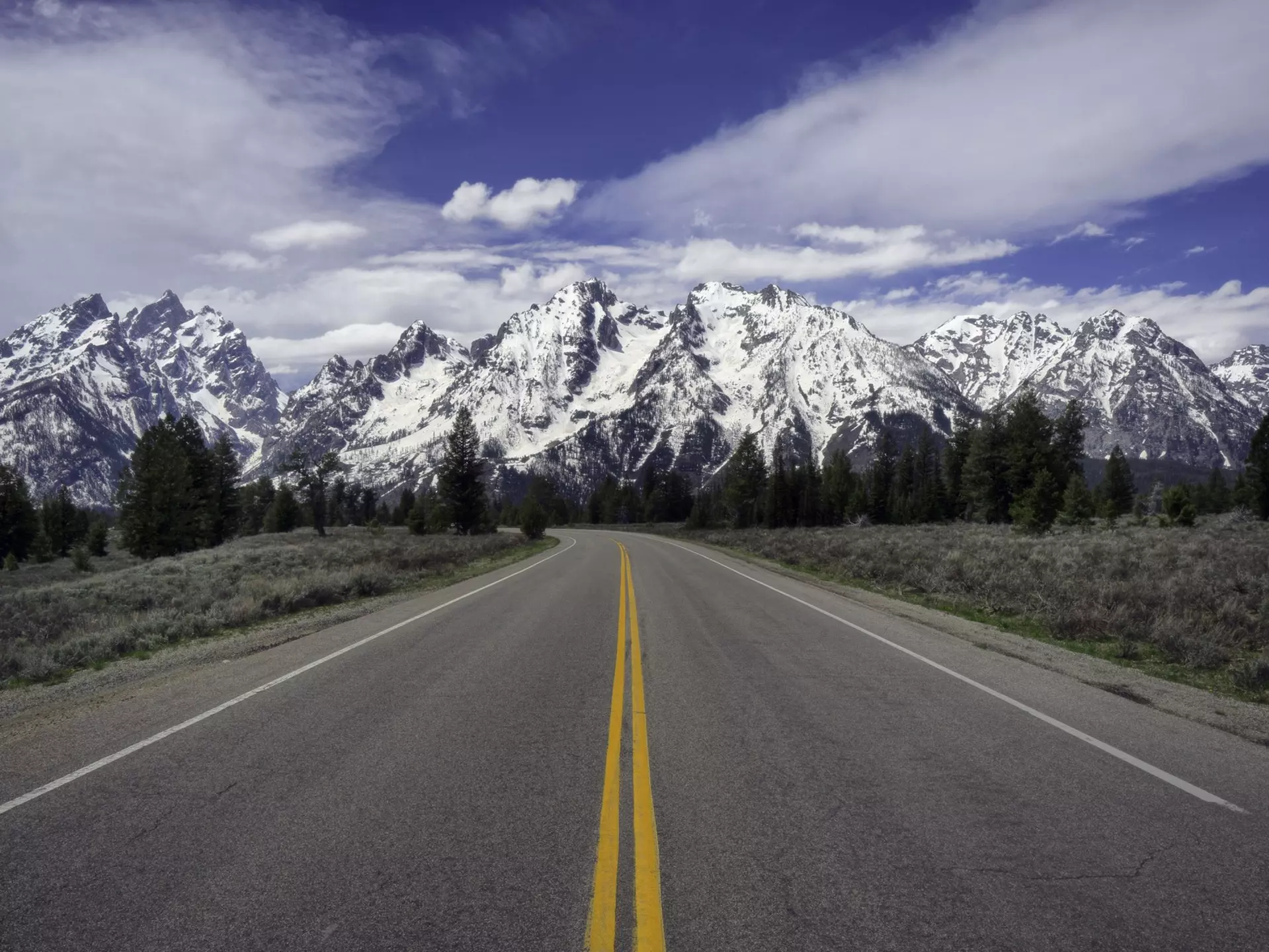Cruise toward that Rocky Mountain ridge with the perfect soundtrack. Jeff R Clow / Getty Images