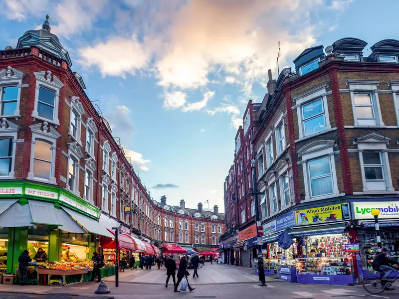 LONDON- FEBRUARY, 2018: Wide angle view of Brixton's Electric Avenue. A famous London shopping street and home of Brixton Market and interesting food outlets.   License Type: media  Download Time: 2023-11-20T22:08:45.000Z  User: Eointloughney87  Is Editorial: Yes  purchase_order:   