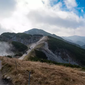 People walk on the path at Untersberg with cloudy sky in Salzburg, Austria.
1138448760
Medium Group Of People, Mountain, Travel, Sunny, Journey, Salzburg, Fog, Tree, Cloud - Sky, Color Image, Rock - Object, Beauty, Scenics - Nature, Nature, Landscape - Scenery, People, Sky, Outdoors, Photography, Beauty In Nature, Travel Destinations, Horizontal, Mountain Peak, Hill, Mountain Range, Austria, Non-Urban Scene, Grass, Valley, Forest, Environment