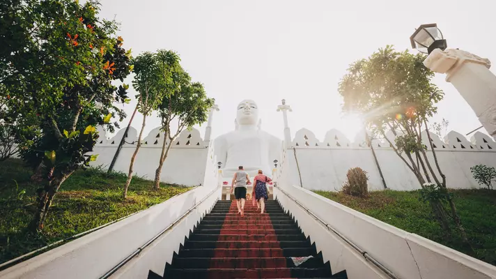 Tourists a the Bahiravokanda Viharaya Buddha temple in Kandy, Sri Lanka