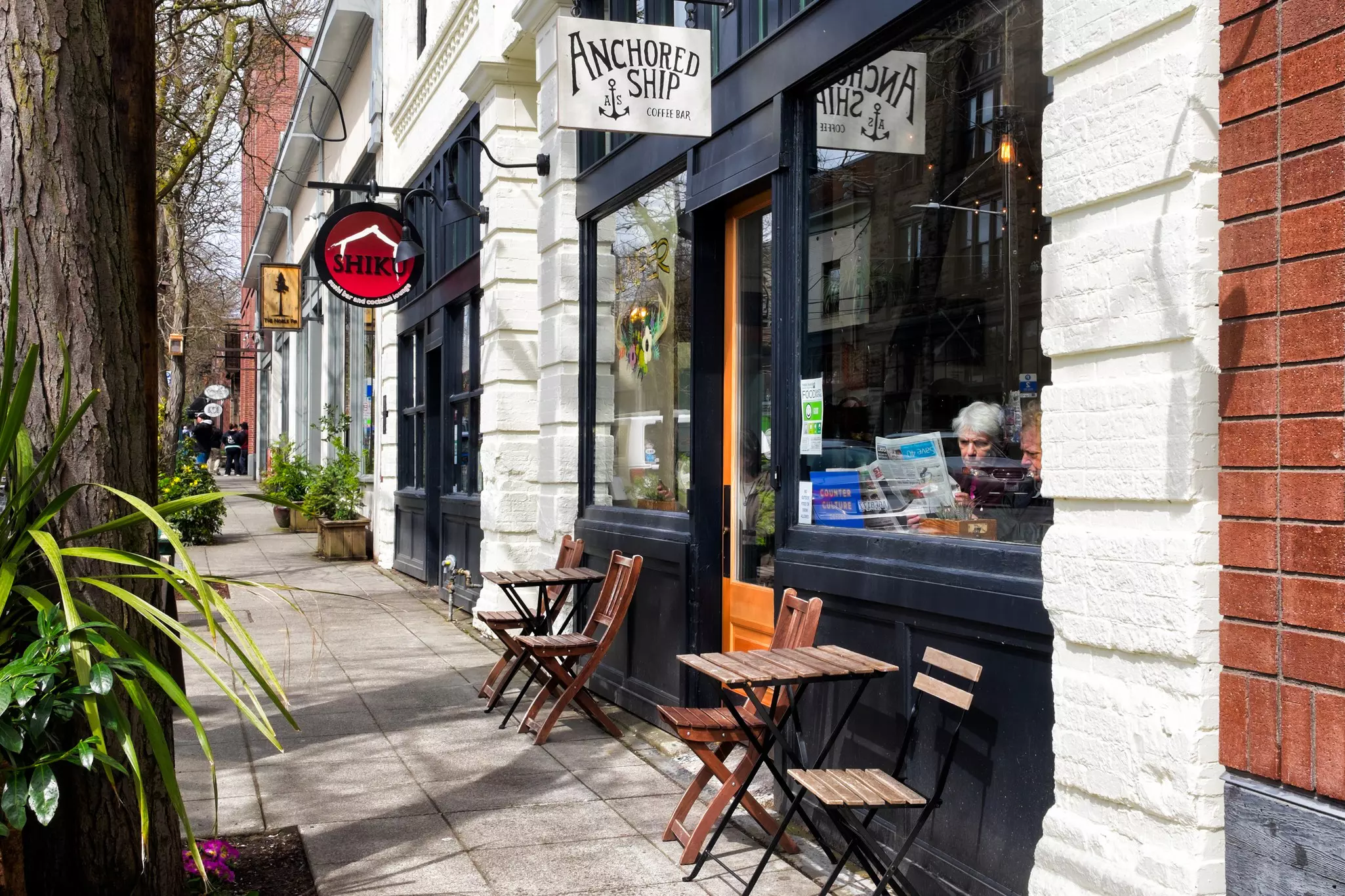 A cafe with tables outside in the Ballard neighborhood of Seattle, Washington.