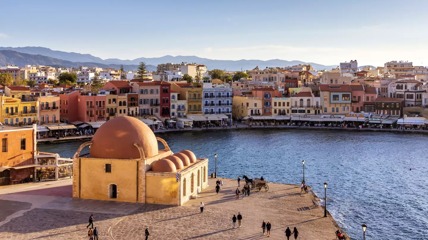 The Venetian harbor at Hania, Crete, with the Kucuk Hasan Pasha Mosque overlooking the water. 
