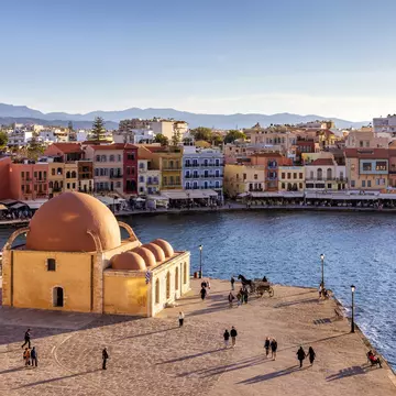 The Venetian harbor at Hania, Crete, with the Kucuk Hasan Pasha Mosque overlooking the water. 