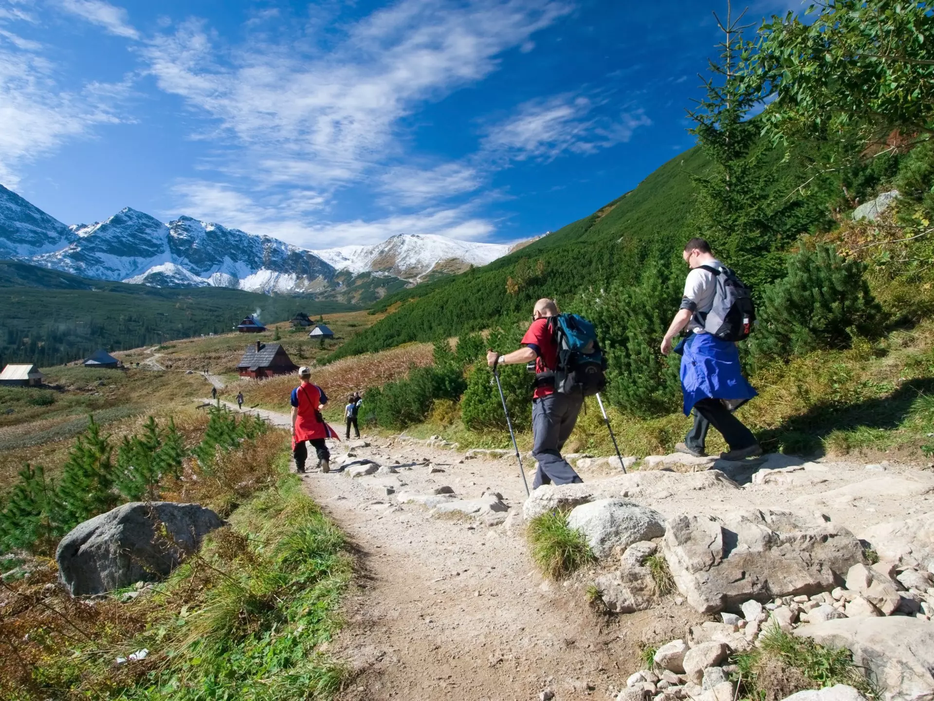 A trio hikes a mountain trail near Zakopane. tramper79 / Shutterstock